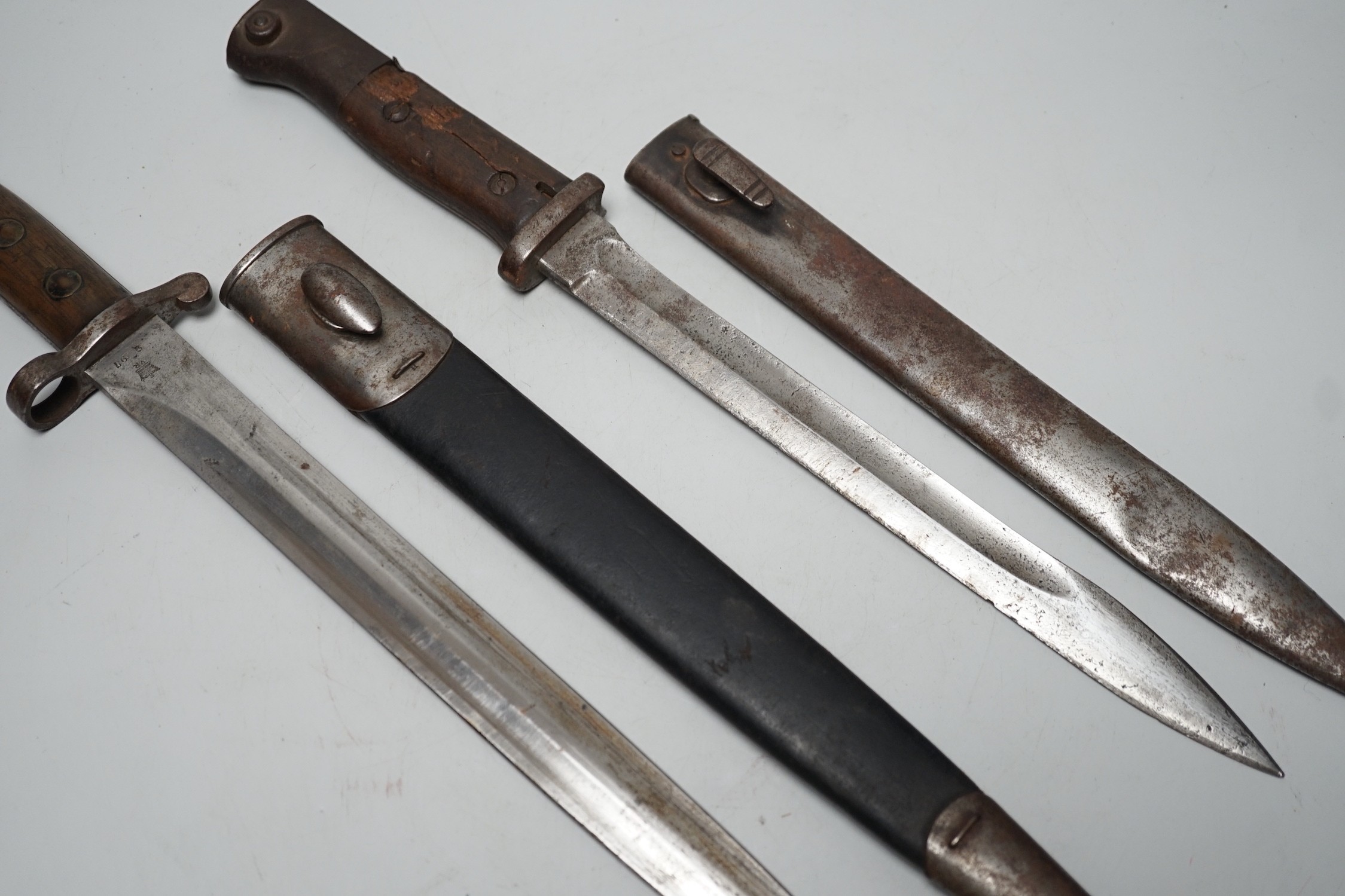A 19th century British bayonet and scabbard together with a German bayonet and scabbard, the blade stamped Gottlieb Hammesfahr Solingen Foche